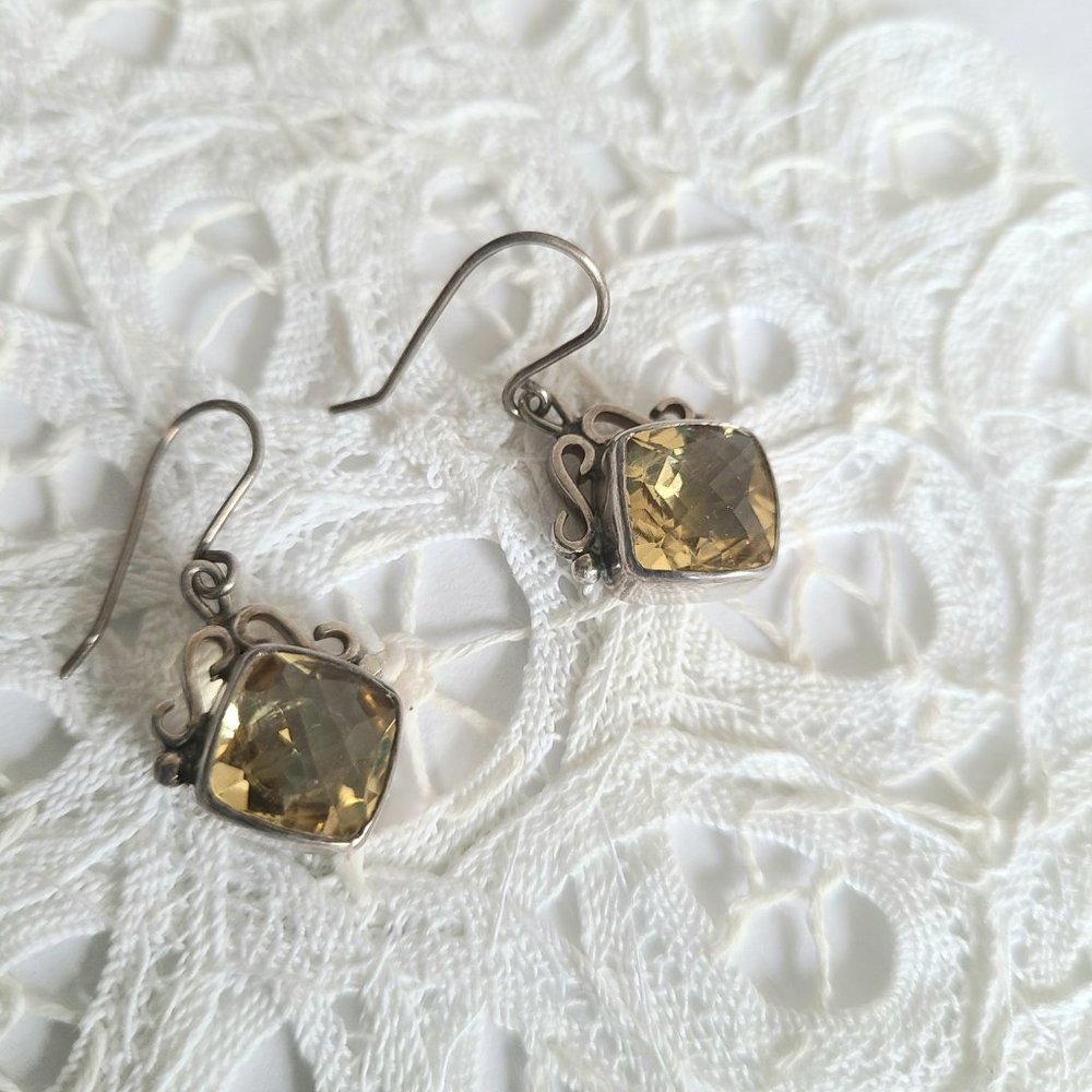 Sterling silver dangling earrings with yellow citrine stone.